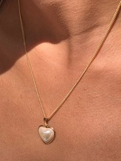 "18 Karat Gold Filled Pearl Heart Charm Necklace The perfect addition to layering with other 14\" or 16\" inch dainty gold chains. An elegant, simple piece that transitions well for daily wear. Material: 18 Karat Gold Filled, Hypoallergenic, Tarnish Resistant. Pendant Size: 17mm x 18mm (without bail) Chain Length: Options available Material: 18 Karat Gold Filled, Hypoallergenic. Tarnish Resistant. Gold-filled does not de-laminate or peel like Gold plated Jewelry nor does it tarnish as readily as Heart Necklace With Pearl Chain For Gift, Heart-shaped Pearl Charm Jewelry For Anniversary, Pearl White Heart-shaped Jewelry With Heart Charm, Heart Pendant Pearl Chain Necklace Gift, Pearl White Heart Charm Necklace, Pearl Chain Necklace With Heart Pendant For Gift, White Pearl Clavicle Chain Necklace For Valentine's Day, White Pearl Clavicle Necklace For Valentine's Day, Valentine's Day Heart Pendant Necklace With Pearl Chain