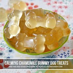 a bowl filled with gummy bears sitting on top of a table