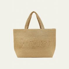 Saint Laurent raffia and viscose tote bag with logo across front  Flat shoulder straps, 8.2" drop  Open top  Interior, one slip pocket  Bronze hardware  Approx. 13.7"H x 16.9"W x 7"D Imported Luxury Double Handle Beach Bag, Designer Straw Bag With Double Handle For Daily Use, Designer Straw Shoulder Bag For Shopping, Designer Double Handle Straw Bag For Daily Use, Designer Straw Bag For Shopping With Top Carry Handle, Luxury Straw Bags For Shopping, Designer Straw Tote Shoulder Bag, Designer Bags With Double Handles In Natural Color, Designer Straw Shoulder Bag For Travel