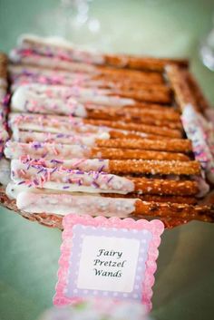 there are many pretzels on the table with happy birthday cards in front of them