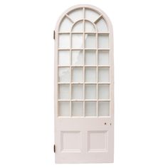 a white door with an arched glass window