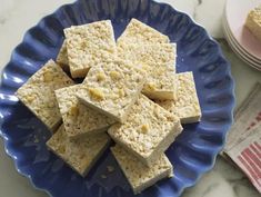 several pieces of rice krispy treats on a blue plate