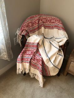 a chair with a blanket on top of it