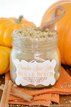 pumpkin spice latte sugar scrub in a glass jar with cinnamon sticks on the side