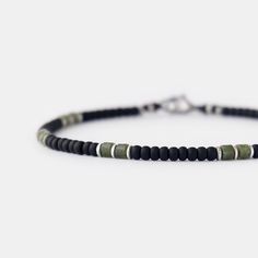 This beaded bracelet is the perfect blend of masculinity and sophistication.  It would make a great boyfriend gift, husband gift, son gift or birthday gift for a special man in your life. Meticulously handcrafted, this minimalist bracelet showcases a harmonious blend of oxidized sterling silver, glass, and green jade beads resulting in a stunning contrast of textures and tones.  It is not only visually captivating but also incredibly easy to wear, making it a perfect choice for everyday outfit. Black Beaded Bracelet, Small Bead Bracelet, Minimal Bracelet, Black Beaded Bracelets, Minimalist Bracelet, Bracelet For Men, Son Gift, Jade Beads, One Bag