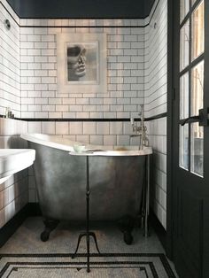 an old fashioned bath tub in a bathroom