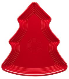 a red plastic christmas tree shaped cake pan on a white background with the shape of a fir tree