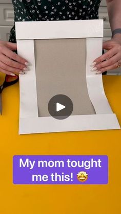 a woman holding up a cut out photo frame with the words my mom taught me this