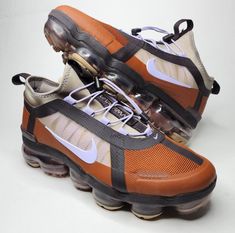 Elevate your sneaker game with these Nike Air VaporMax 2019 Utility in brown color. Designed for women, these sneakers feature a low top shoe shaft style with W shoe width to provide ultimate comfort while walking or running. The shoes are available in UK shoe size 6, US shoe size 8.5, and EU shoe size 40. Crafted with high-quality materials, these Nike Air VaporMax 2019 sneakers are perfect for athletic activities like running, jogging, and gym workouts. The product line includes Nike Air Vapor Nike Air Vapormax 2019, Vapormax 2019, Air Vapormax, Sneaker Games, Nike Air Vapormax, Top Shoes, Brown Color, Gym Workouts, Low Top