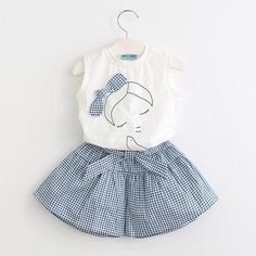 Elevate your little one`s style with this delightful Casual Girls Summer Flower T Shirt Shorts set. Crafted with utmost care and attention to detail, this outfit is truly one-of-a-kind, ensuring your girl stands out in the crowd. Absolutely adorable. Expertly made from a blend of premium cotton and polyester for durability and comfort. Soft and gentle on your child`s delicate skin. Designed for all-day wear during the summer season, suitable for various occasions. Sleeveless design for unrestricted movement and added breathability. Gives a perfect fit, making sizing a breeze. Specifically designed for baby girls. Features a charming floral print that adds a touch of playfulness. Package includes one complete set. Short Girl Outfits, Girls Holiday Outfit, Rok Tutu, Flower T Shirt, Toddler Girl Summer, Girls Summer Outfits