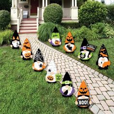 halloween yard decorations with pumpkins and jack - o'- lanterns on the lawn