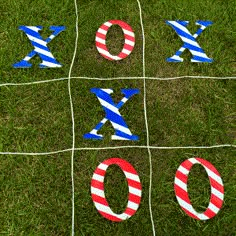 tic - tac - toe game with the letters xo and o on grass