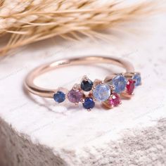 Antique Handcrafted Multi-Gemstone Ring, Birthstones Ring, Dainty Family Ring, Round Fashion Jewel, Personalized Gift, Mother's Day Gift Description: Main Stone - Sapphire, Ruby, Amethyst Stone Creation:  Lab Created  Stone Size - 2 / 3 mm Stone color -Blue, Red, Purple Stone shape - Round Stone Birth month: September , July , February  Stone cut - Brilliant Cut Finishing- Excellent feel free to contact me if you have any questions  Gemstone color may slightly vary from listed image due to the nature of all natural gemstone or different monitor settings TURNAROUND TIME Your order will be ready for shipment in 4-8 business days. Free economy shipping for US, UK, Germany- 10-15 business days delivery time. shipping upgrade available for US, UK, Germany- 5-7 business days delivery time. Pleas Multi Gemstone Ring, Family Rings, Purple Stones, Stone Cuts, Amethyst Stone, Birthstone Ring, Gemstone Colors, Mother's Day Gifts, Natural Gemstones