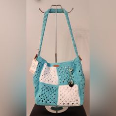 Medium Sized Crochet Bag Teal Blue And White. White Liner With Storage Pocket And Magnetic Button Clasp. Missing Charm Handmade From Italy Blue Granny Square Bag For Vacation, Blue Crochet Bag With Granny Square For Everyday, Blue Granny Square Crochet Bag For Vacation, Blue Summer Crochet Bag For Daily Use, Blue Crochet Bag For Vacation, Blue Crochet Bag With Granny Square For Beach, Summer Blue Crochet Bag With Adjustable Strap, Blue Crochet Bag With Adjustable Strap For Summer, Blue Casual Crochet Bag With Adjustable Strap