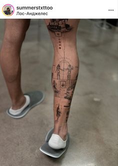 a person standing on top of a pair of shoes with their legs covered in tattoos