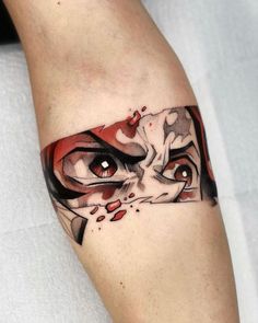 a woman's leg with an artistic tattoo design on her left thigh and eye