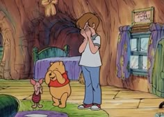 winnie the pooh and piglet in front of a tree house with a woman looking at it