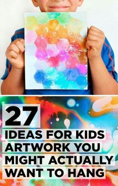 a young boy holding up a piece of art with the words 27 ideas for kids artwork you might actually want to hang on