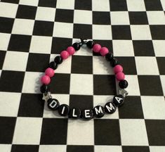 Green Day - Dilemma inspired homemade beaded bracelet. Bracelet is elastic to fit most wrists! Pink and black Green Day Bracelet Ideas, Green Day Band, Band Bracelets, Bracelet Ideas, Band Bracelet, Christmas Deals, Green Day, Beads Bracelet, Pink And Black