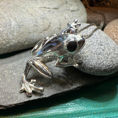 TAKE AN ADDITIONAL 20% OFF THE ALREADY REDUCED SALE PRICE - ADDITIONAL 20% IS DEDUCTED AT CHECKOUT with code SAVE20 Solid Sterling silver with natural shell on an 18" chain. Adorable little frog with abalone shell inlay on his back. Frogs symbolize alertness and readiness, as they always respond to nature's timing. As frogs croak before the rains, they are considered bringers of rain, cleansing, and fertility. The visible changes over the course of their life (from tadpole to frog) make them sym Tadpole To Frog, Frog Necklace, Frog Jewelry, Tree Necklace, Crystal Design, Abalone Shell, Sterling Silver Chains, Sterling Silver Pendants, Silver Pendant