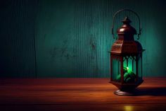 a green lantern sitting on top of a wooden table next to a dark wood wall