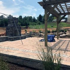 an outdoor patio is being built in the backyard