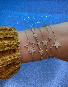 "𝓦𝓮𝓵𝓬𝓸𝓶𝓮 𝓽𝓸 𝓛𝓲𝓸𝓷𝓱𝓮𝓪𝓻𝓽 𝓳𝓮𝔀𝓮𝓵𝓻𝔂 𝓢𝓱𝓸𝓹 ♥ Beautiful and delicate Diamond Star Charm Bracelets available in 4 variations. Please allow 1-5 weeks for delivery. *Please check measurements below, items may appear larger on the screen. ♥ 5 mini Star Bracelet with pave diamonds with 6 bezel set diamonds Measurements: 5.5mm Length: 7\" adjustable to 6.5\" Diamonds: 0.29 Carats ♥ 1 Star Full Pave Diamond Single Star Bracelet with 6 bezel set diamonds Measurements: 14.5mm Length: Luxury Dainty Star Jewelry, Cheap Sparkly Gold Jewelry, Cheap Casual Star-shaped Bracelets, Affordable Gold Jewelry With Star Charm, Diamond Star Gold Jewelry, Affordable Trendy Jewelry With Star Charm, Luxury Minimalist Jewelry With Star Charm, Cute Cheap Jewelry With Star Charm, Cheap Summer Jewelry With Star Charm