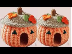 two crocheted pumpkins with leaves on them, one has a hole in the middle