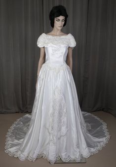 a mannequin dressed in a white wedding dress