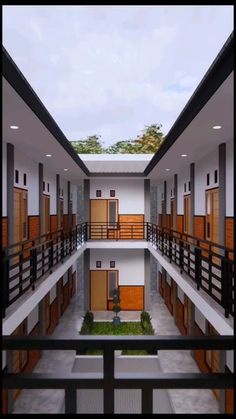 the inside of a building with multiple balconies and wooden doors on each floor