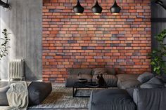 a living room filled with furniture and a brick wall behind the couches in front of it