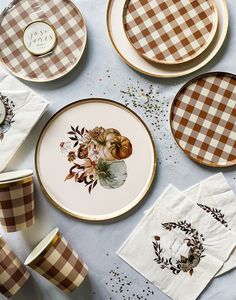 plates and napkins are laid out on a table