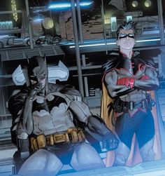 batman and catwoman sitting in front of a window