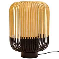 a lamp made out of bamboo sticks on a white background