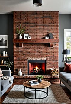 a living room with two couches and a fire place in the middle of it