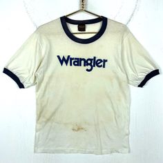 Vintage Wrangler 1980s Ringer T-Shirt Large Single Stitch Made In Usa Distressed Size/Measurements (Based in inches) Size - Large Pit to pit - 20" Length - 27" Condition / Details Vintage fading to the original color of the fabric Stains found on front, on back and on right sleeve Discoloration on front and on back Combined Shipping: We provide combined shipping, please contact us for a quote 70s Ringer Tee Outfit Men, Vintage Washed Relaxed Fit T-shirt, Ringer Tee Outfit, Retro Ringer Tee, Vintage Ringer Tshirt, Wrangler Vintage, Ringer Shirt, Fabric Stains, Vintage Wrangler