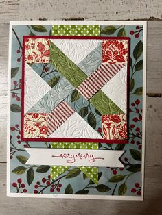 a close up of a card with a quilted design on the front and bottom