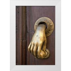 a door handle with a hand on it