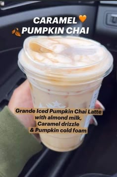 someone is holding up a cup of pumpkin chai latte in their hand, with the caption caramel cold foam