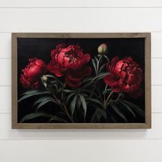 a painting of red flowers on a black background