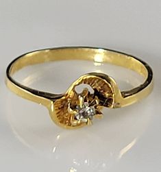 *Size 6.25-easily re-sizeable by a capable jeweler. *Victorian style 0.10 ctw Natural Diamond Bypass style ring set in solid 14KT Yellow Gold. *Diamond specifications: 1/6 ctw stamped on interior of band. Color H-J, Clarity SI2-I2 (very eye-clean with some inclusions visible upon VERY close inspection). *Stamped 14KT with a Crown picto Maker's Mark. *Perfect ring for Engagement, Promise Rings, Graduation or Birthday presents, or just a sparkling, petite diamond ring for a loved one-especially yo Luxury Victorian Yellow Gold Rings, Victorian Style Hallmarked Yellow Gold Flower Ring, Victorian Gold Open Ring, Victorian Yellow Gold Diamond Ring With Single Diamond, Buttercup Ring, Victorian 14k Yellow Gold Diamond Ring, Cluster Pendant, Opal Necklace, Matching Bracelets