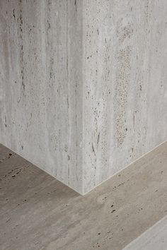 the corner of a building with concrete blocks