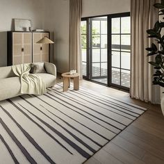 a living room filled with furniture and a sliding glass door leading to an outside deck