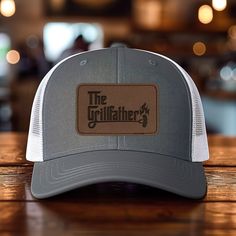 *Add some personality to your wardrobe with our leather patch hat design. *60% cotton/ 40% polyester, 100% polyester mesh backed trucker snapback cap, faux-leather laser engraved patch *Structured six-panel, mid-profile with pre-curved bill and adjustable plastic snapback closure *One size first most. Hat sizing: 7 - 7 3/4 inches, crown height approx 6 1/2 " *Faux-leather patches are engraved in the USA Outdoor Trucker Hat With Letter Patch And Curved Brim, Trucker Baseball Cap With Leather Patch, Trucker Hat With Letter Patch And Flat Brim, Outdoor Hats With Letter Patch And Curved Bill, Leather Baseball Cap With Logo Patch For Outdoor, Outdoor Hats With Letter Patch And Curved Brim, Outdoor Hats With Curved Brim And Letter Patch, Outdoor Hat With Curved Brim And Letter Patch, Outdoor Curved Bill Hats With Letter Patch