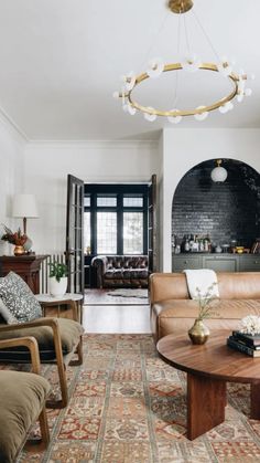 a living room filled with furniture and a fire place