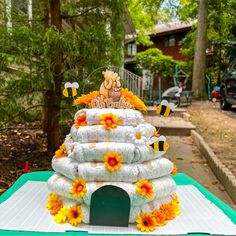 a cake made to look like a beehive with sunflowers and bees around it