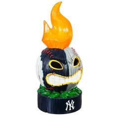 an inflatable pumpkin with a new york yankees hat on it's head