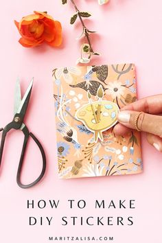 a hand holding a sticker next to scissors and flowers on a pink background with the words how to make diy stickers