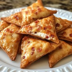 a white plate topped with cheesy pizza triangles