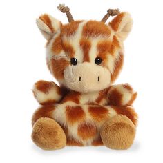 a brown and white stuffed giraffe sitting on top of it's legs